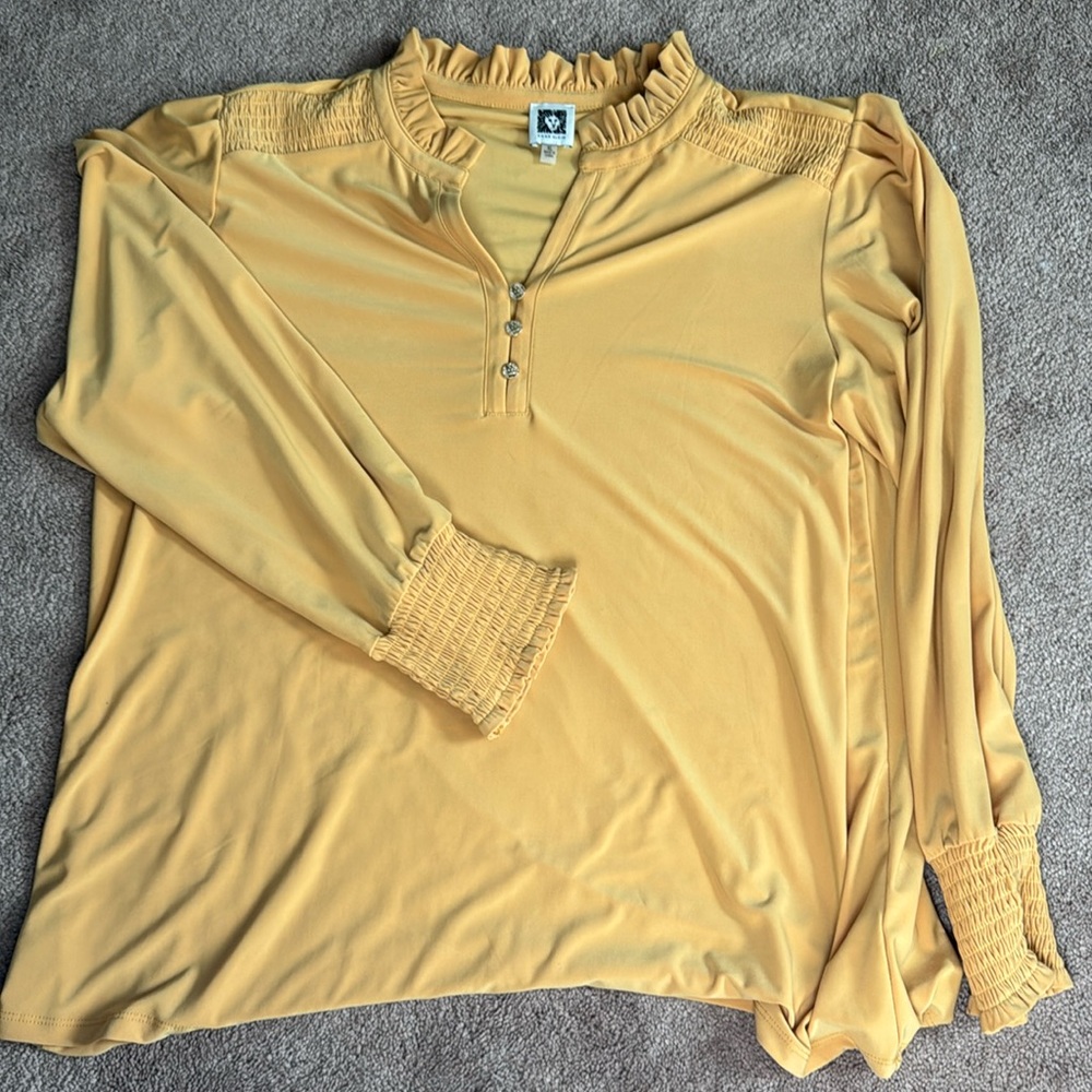 Anne Klein blouse with frilly edges. Good condition. Dress up or down.